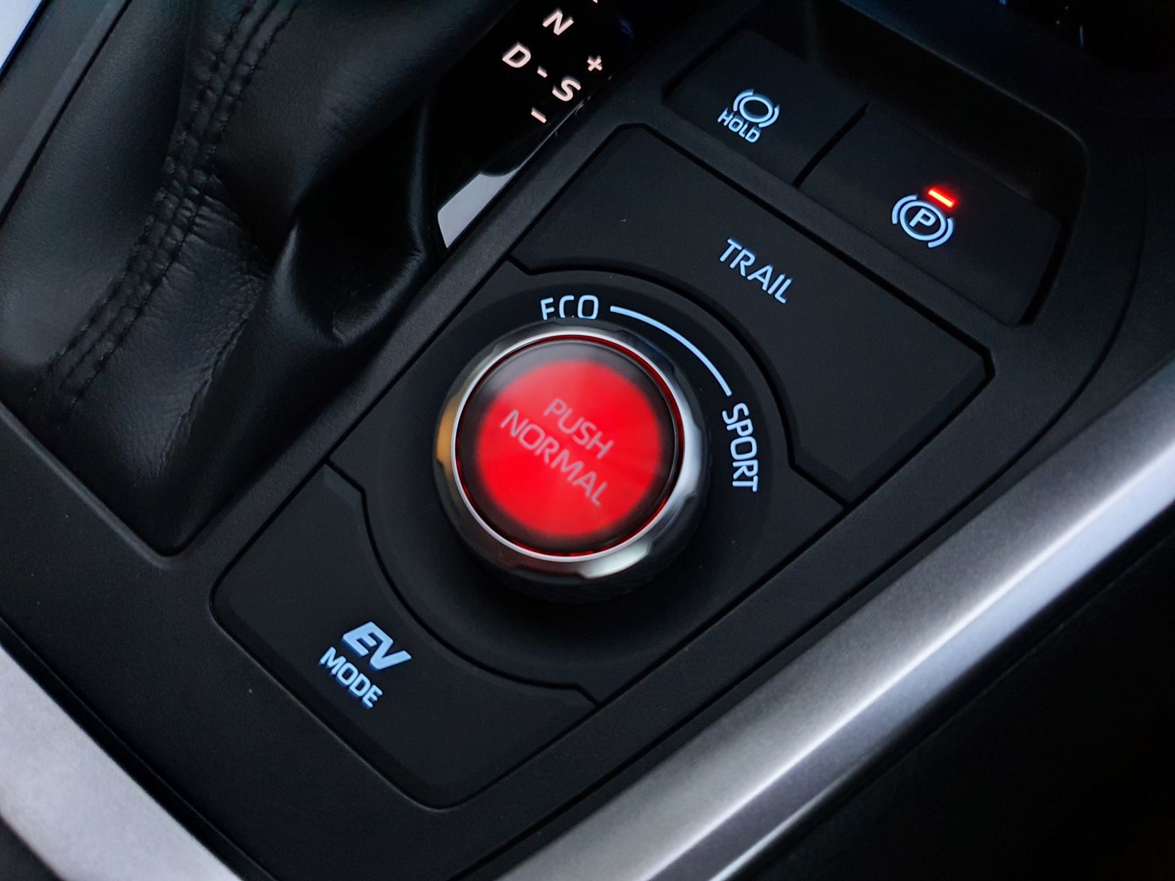 View of the sport mode button in red in the new Toyota RAV4 Hybrid XSE