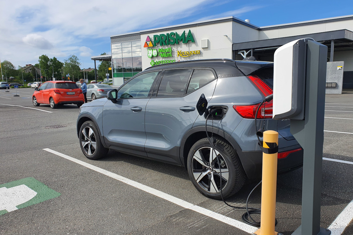 Charging Volvo XC40 Recharge at supermarket carpark.
