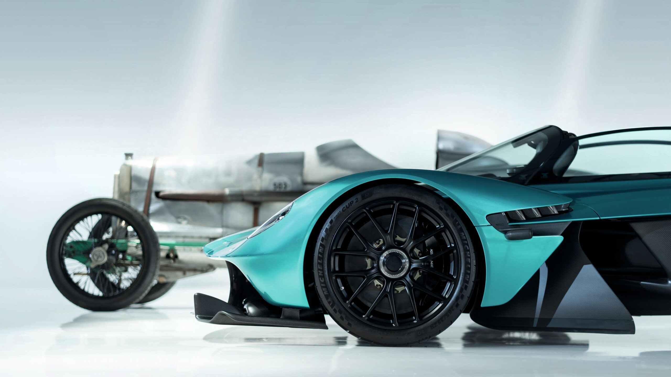 An Aston Martin Valkyrie in the foreground with an Aston Martin racer Razor Blade in the background.