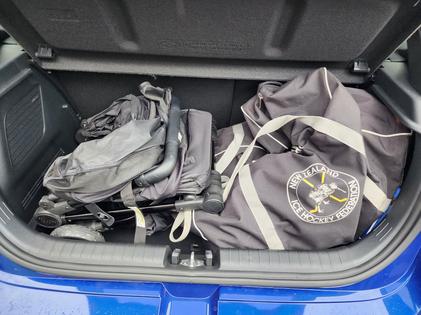 Hyundai i20 N boot filled with a pram and an ice hockey bag.