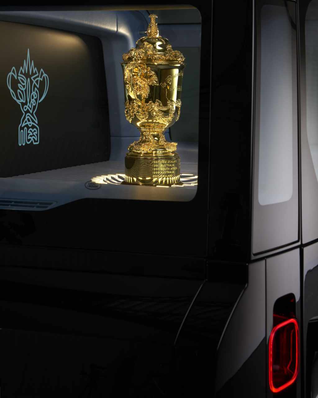 A side view of the Webb Ellis Cup inside the trophy cabinet of the Defender 110.