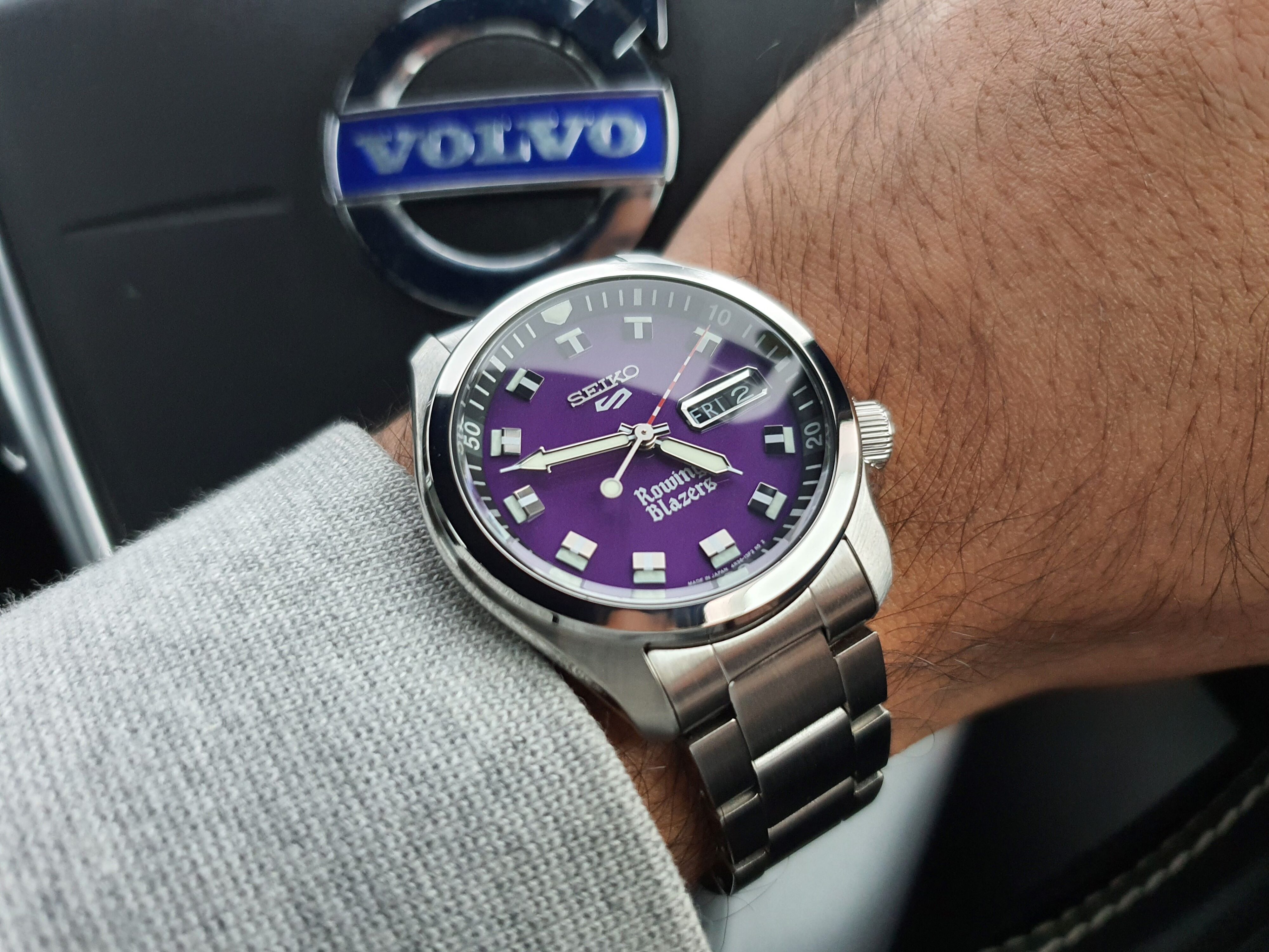 A shot of the Seiko 5 x Rowing Blazers purple dial wristwatch on the wrist of Matthew D'Souza.