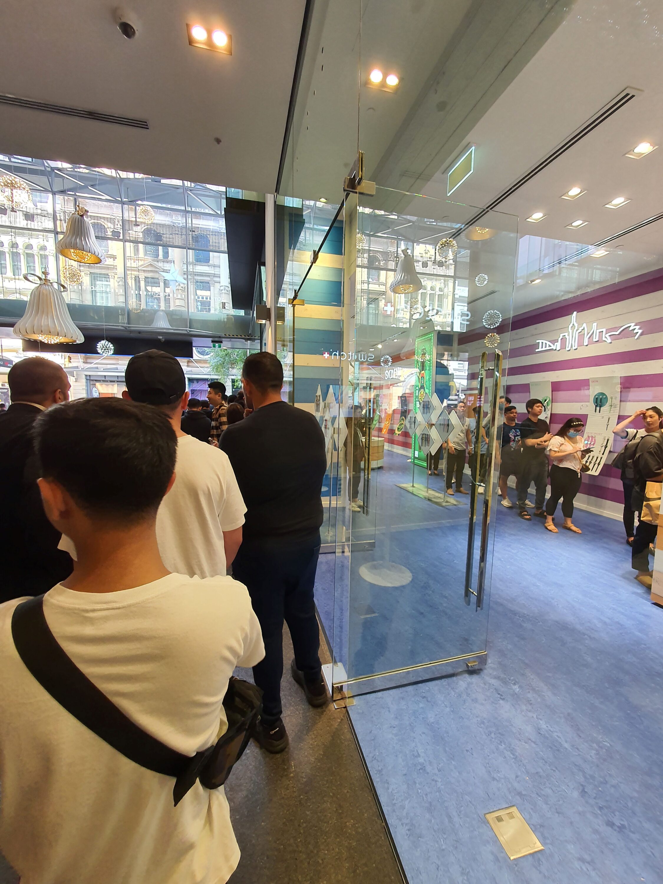 A queue for the Omega x Swatch Moonswatch at the Swatch shop in Sydney, Australia.