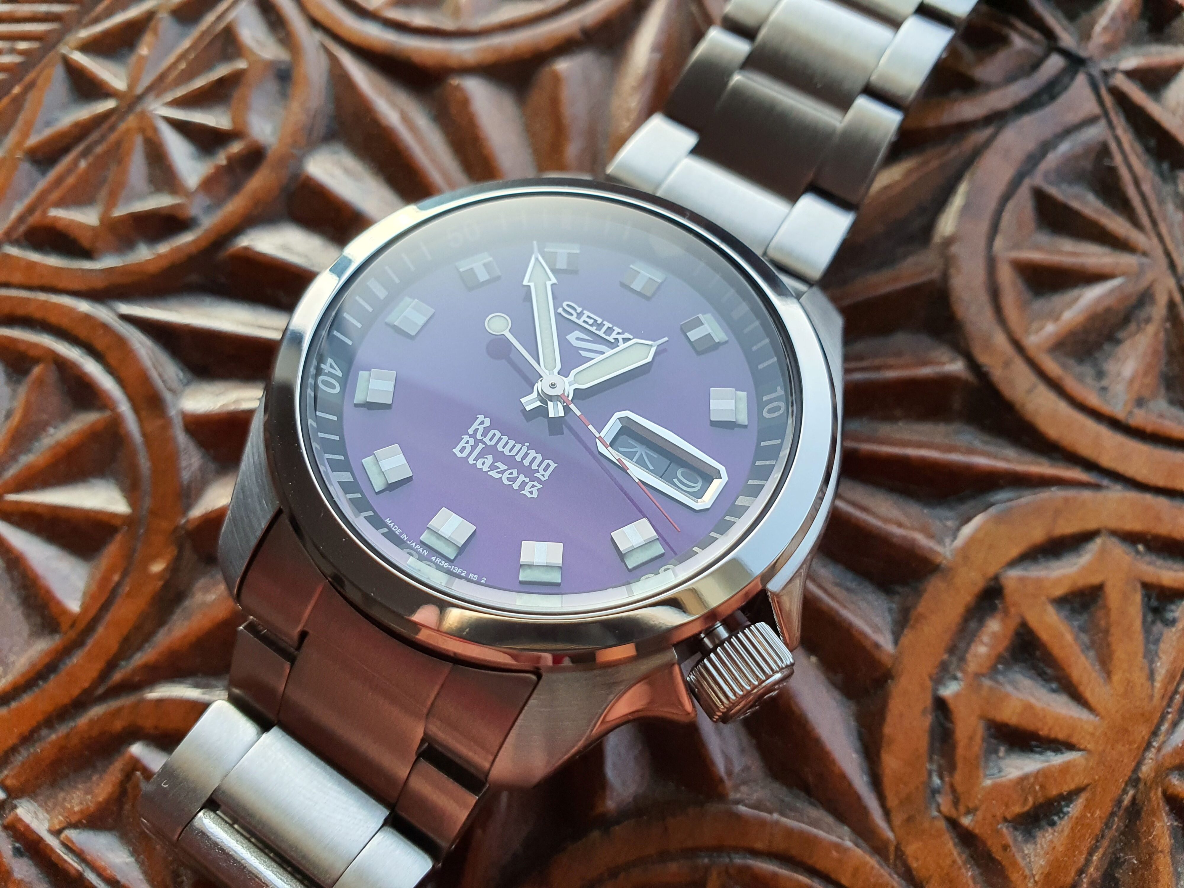 Close up angled photo of the Seiko 5 x Rowing Blazers purple dial wristwatch