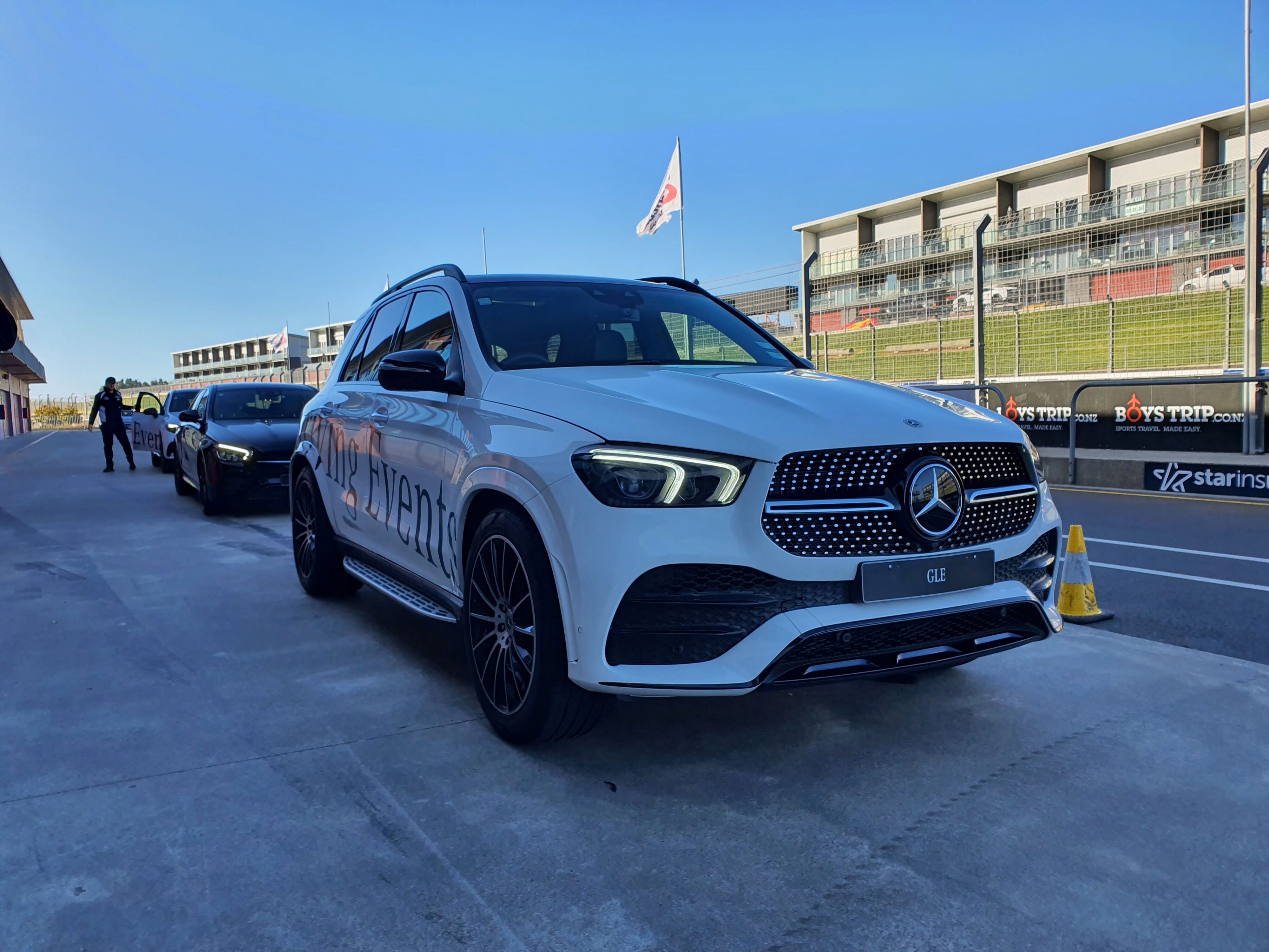 A Mercedes GLE SUV in the foreground with other Mercedes-Benz passenger cars in the background at Mercedes' Driving Events at Hampton Downs Motorsport Park NZ
