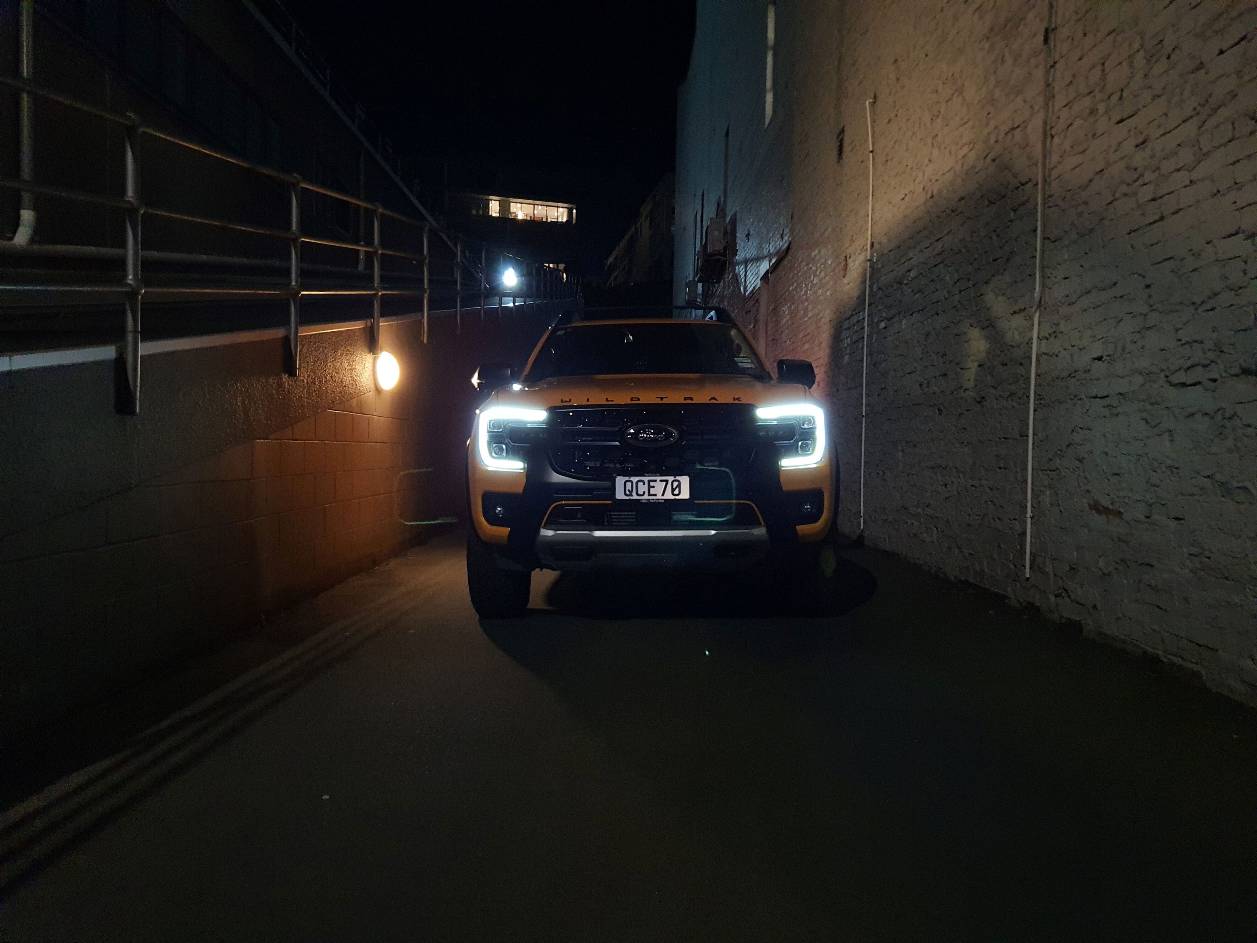 Front on view of a 2023 Ford Ranger Wildtrak X at night with the LEDs turned on.