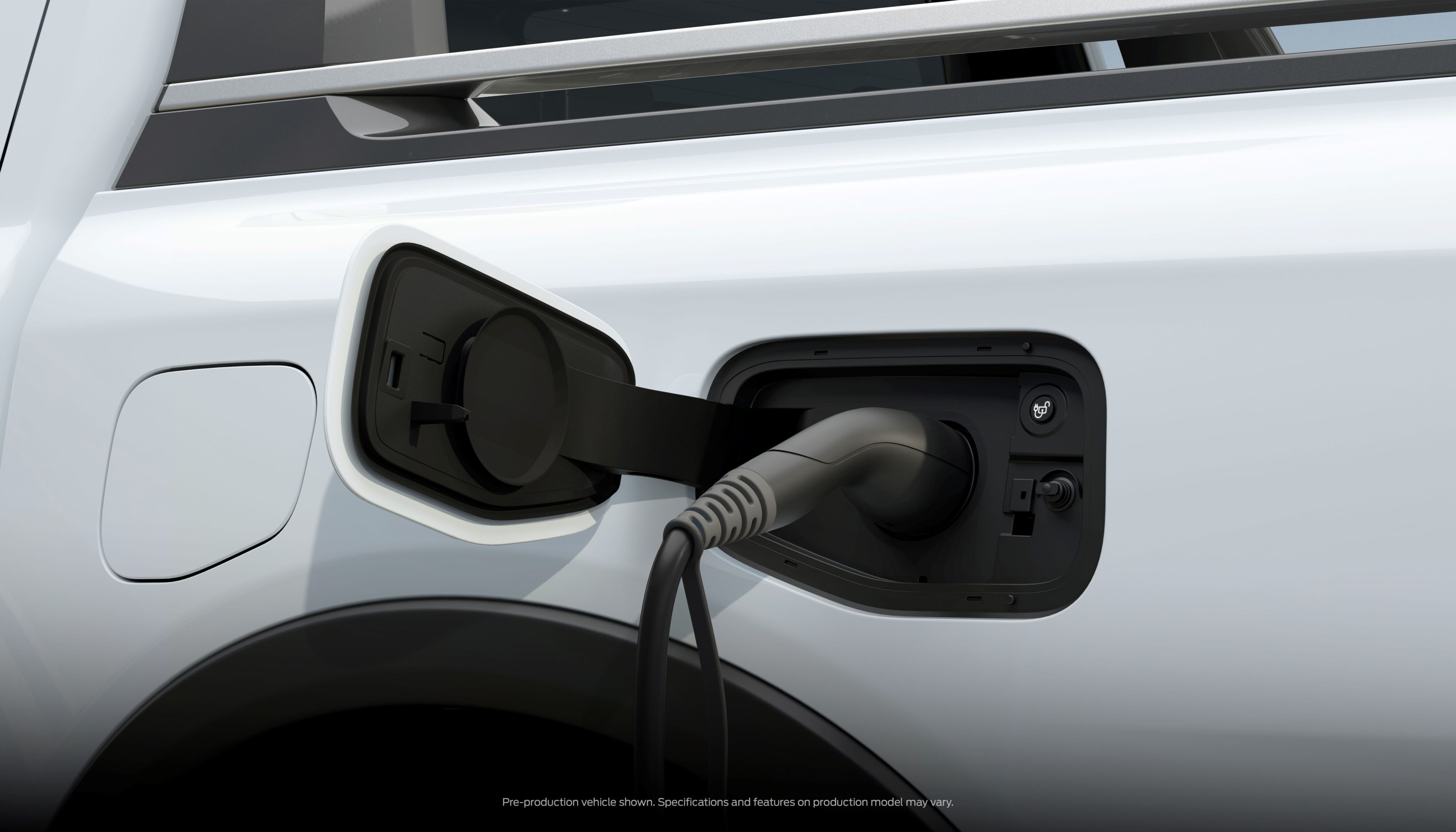 Close-up view of the charging port on a 2023 Ford Ranger PHEV.