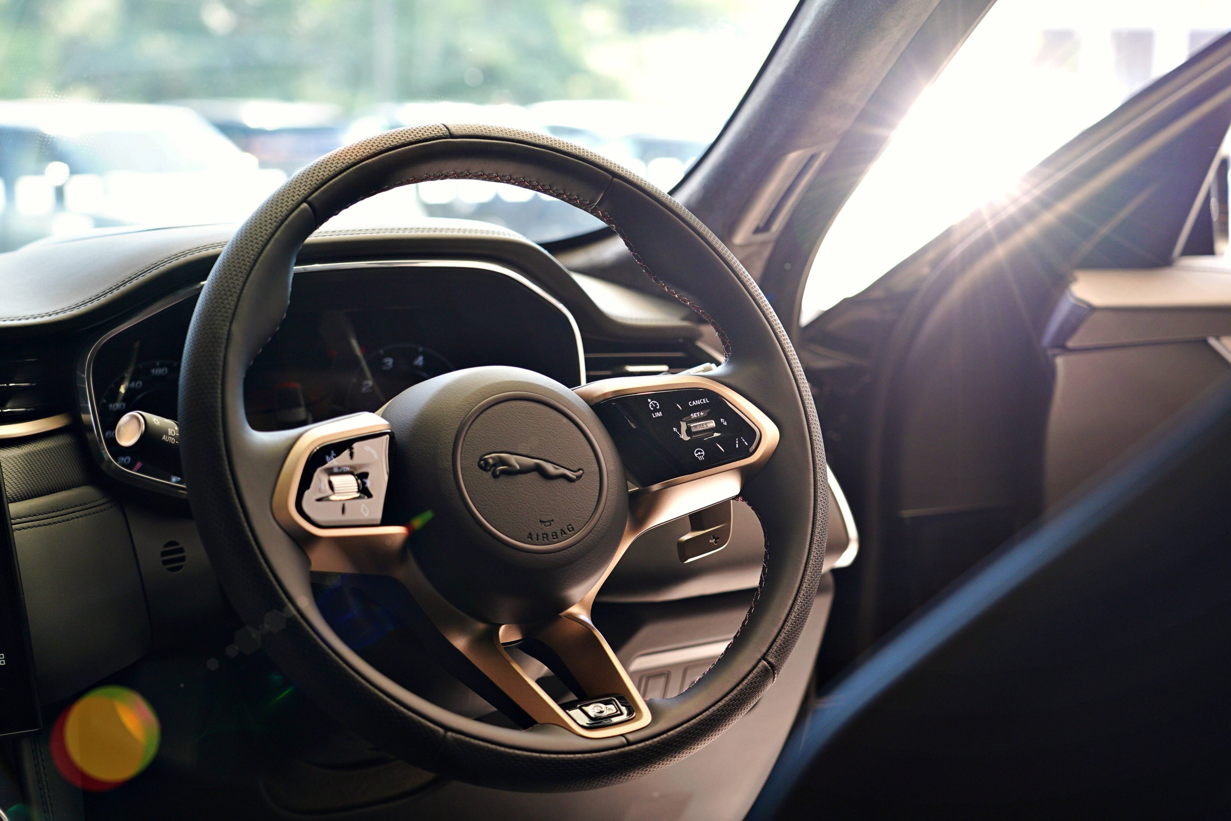 Steering wheel on the Jaguar F-Pace SVR Edition 1988 highlighted in Sunset Gold Satin details.