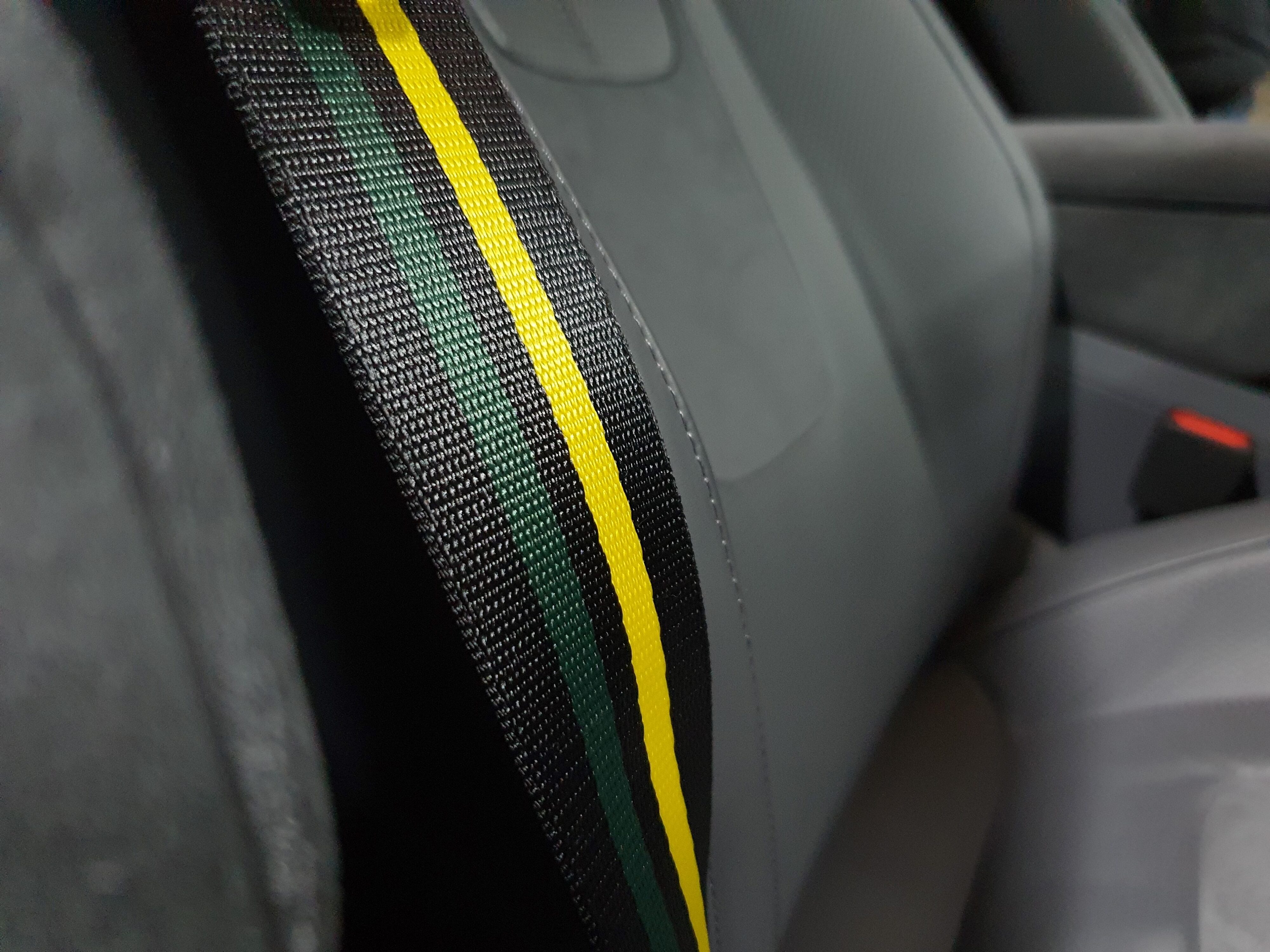 Lotus colour scheme seatbelts on the interior of a 2024 Eletre R.