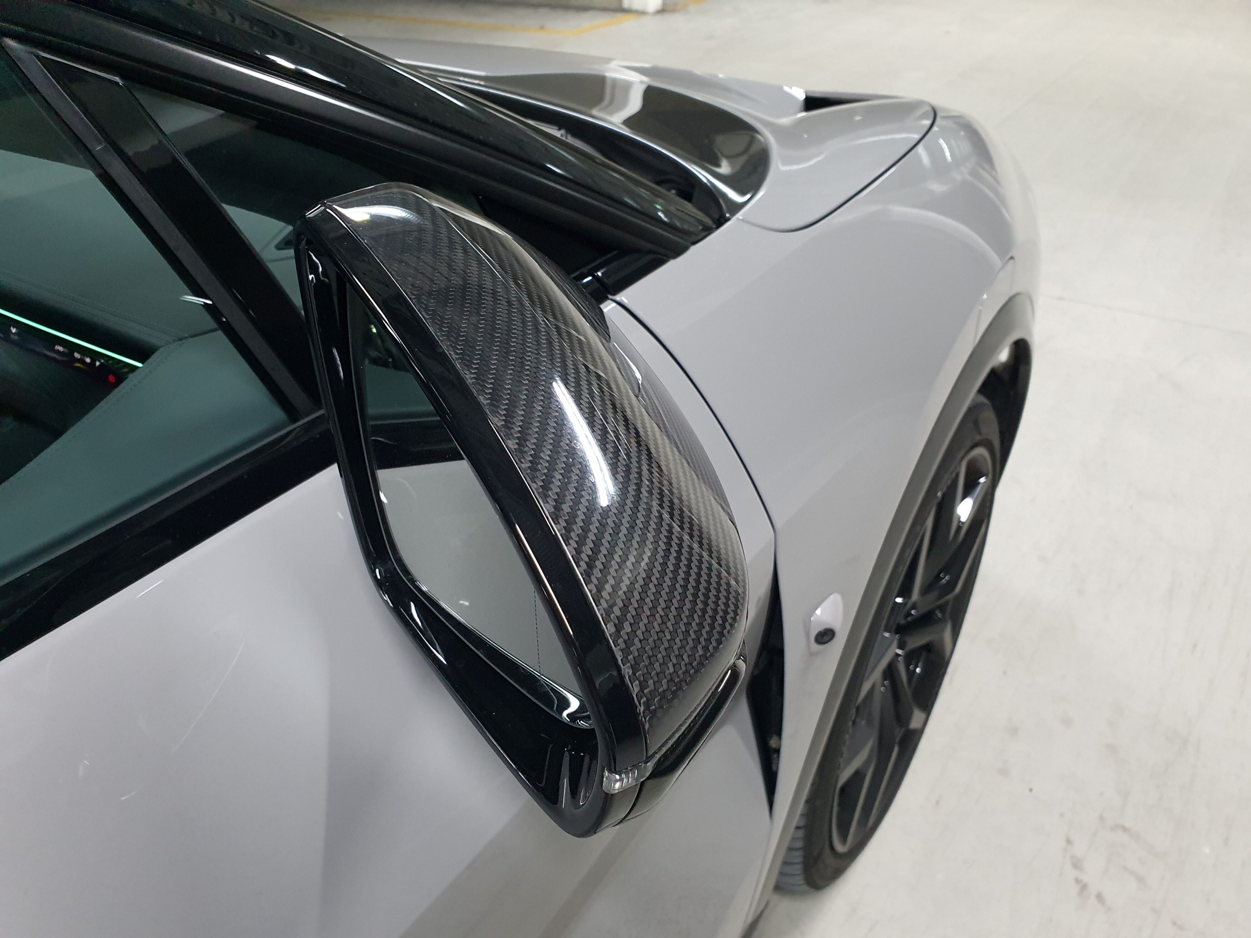 Carbon fibre wing mirror cover on a 2024 Lotus Eletre R.