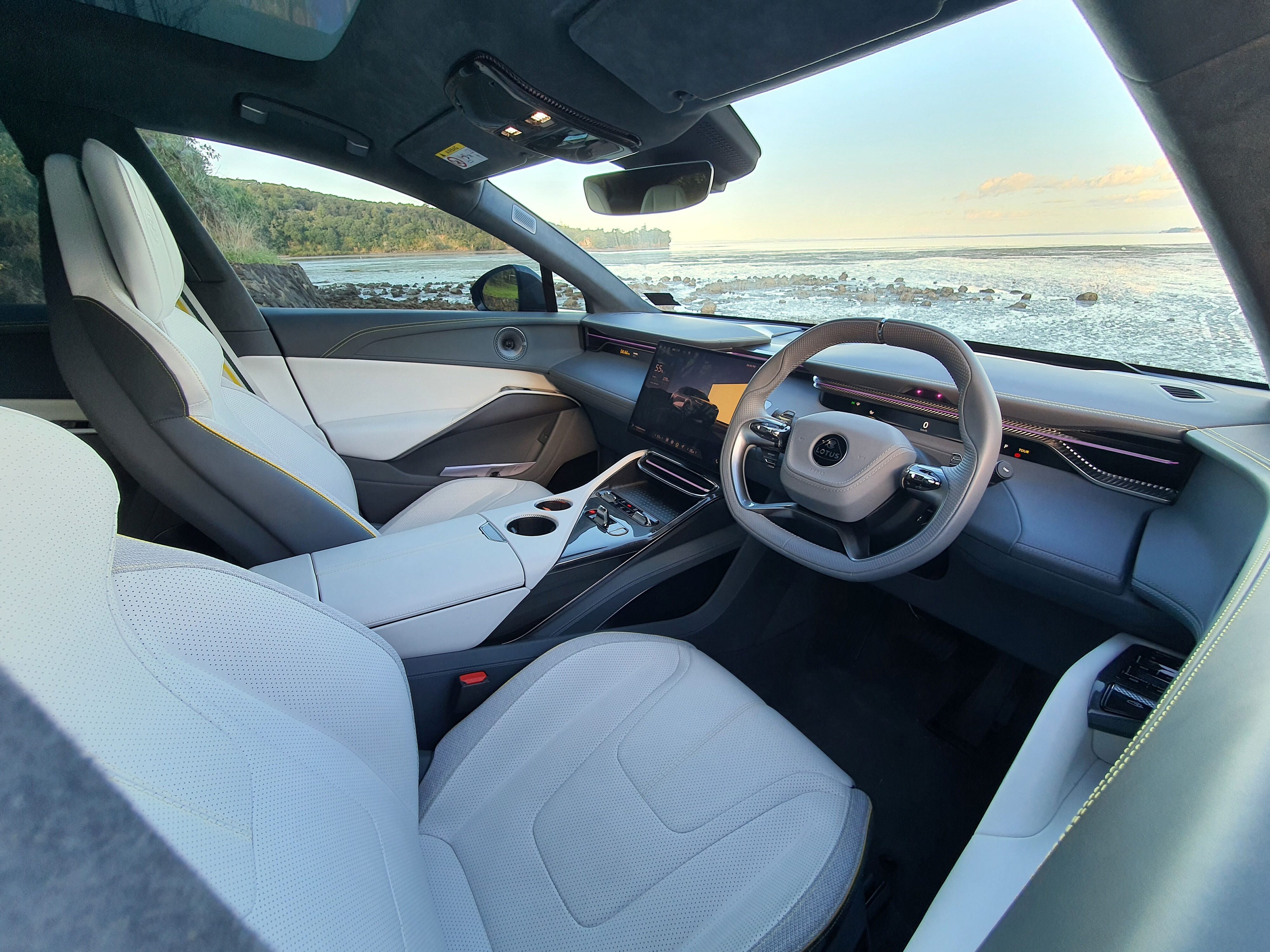 Quartz optioned interior on a 2024 Lotus Eletre S with a coastal outlook from the windscreen.