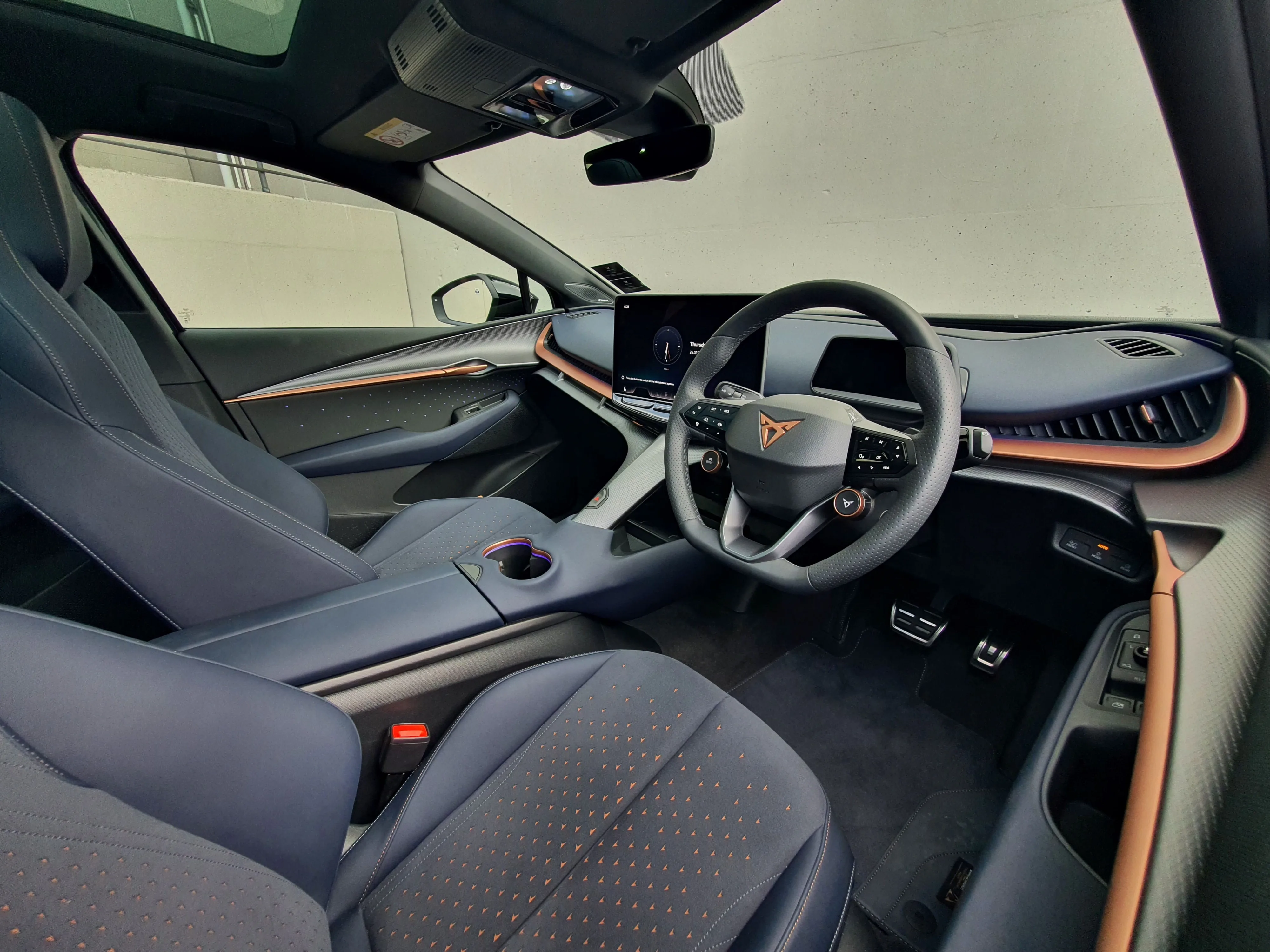 Interior view of a 2025 Cupra Tavascan VZ in Tavascan Blue.