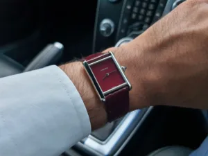 Cartier Tank in Claret (Burgundy), photographed on Matthew's left wrist.
