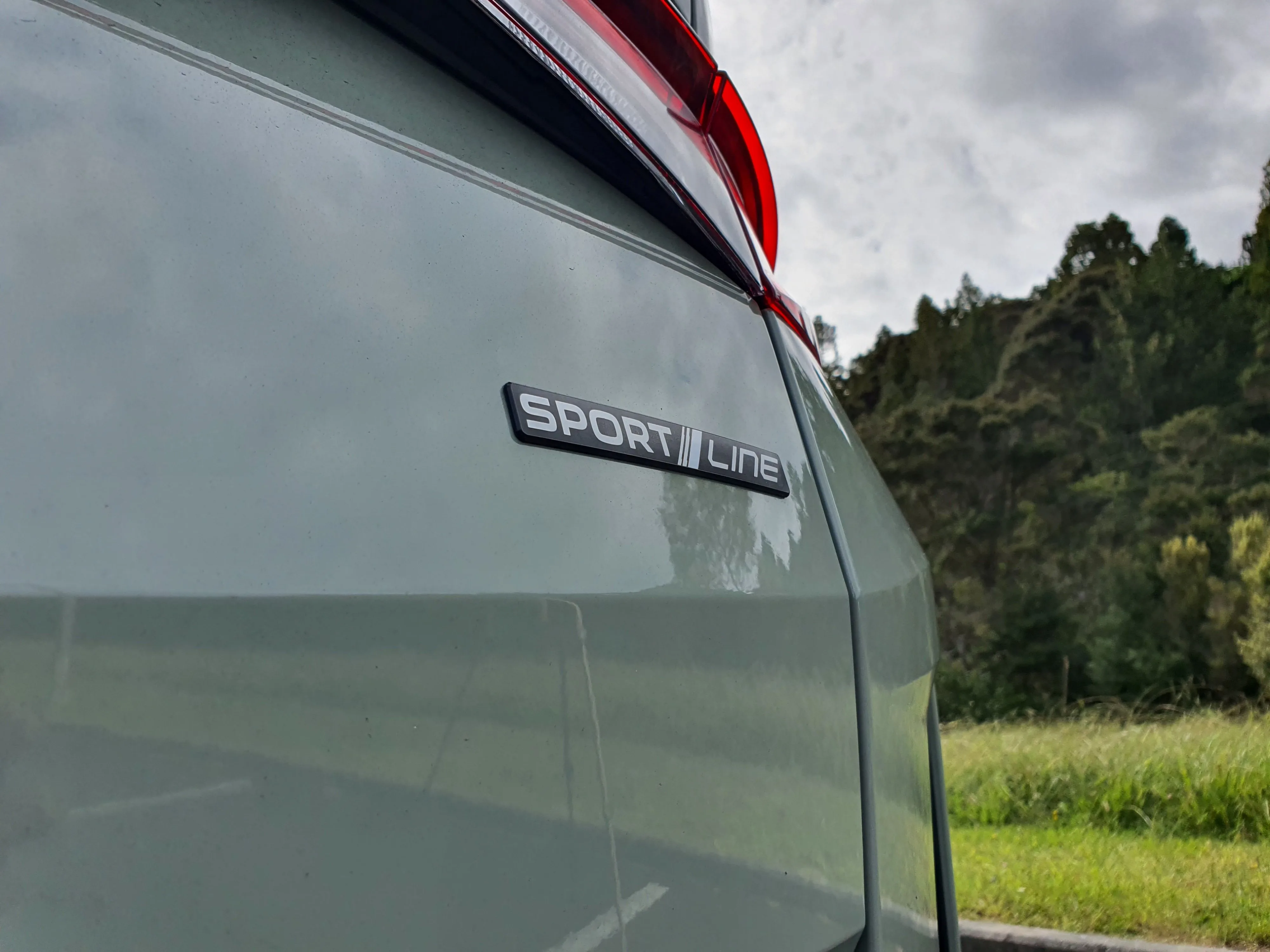 Close up of the Sportline badge on the rear of a 2026 Skoda Elroq Sportline in Timiano Green.