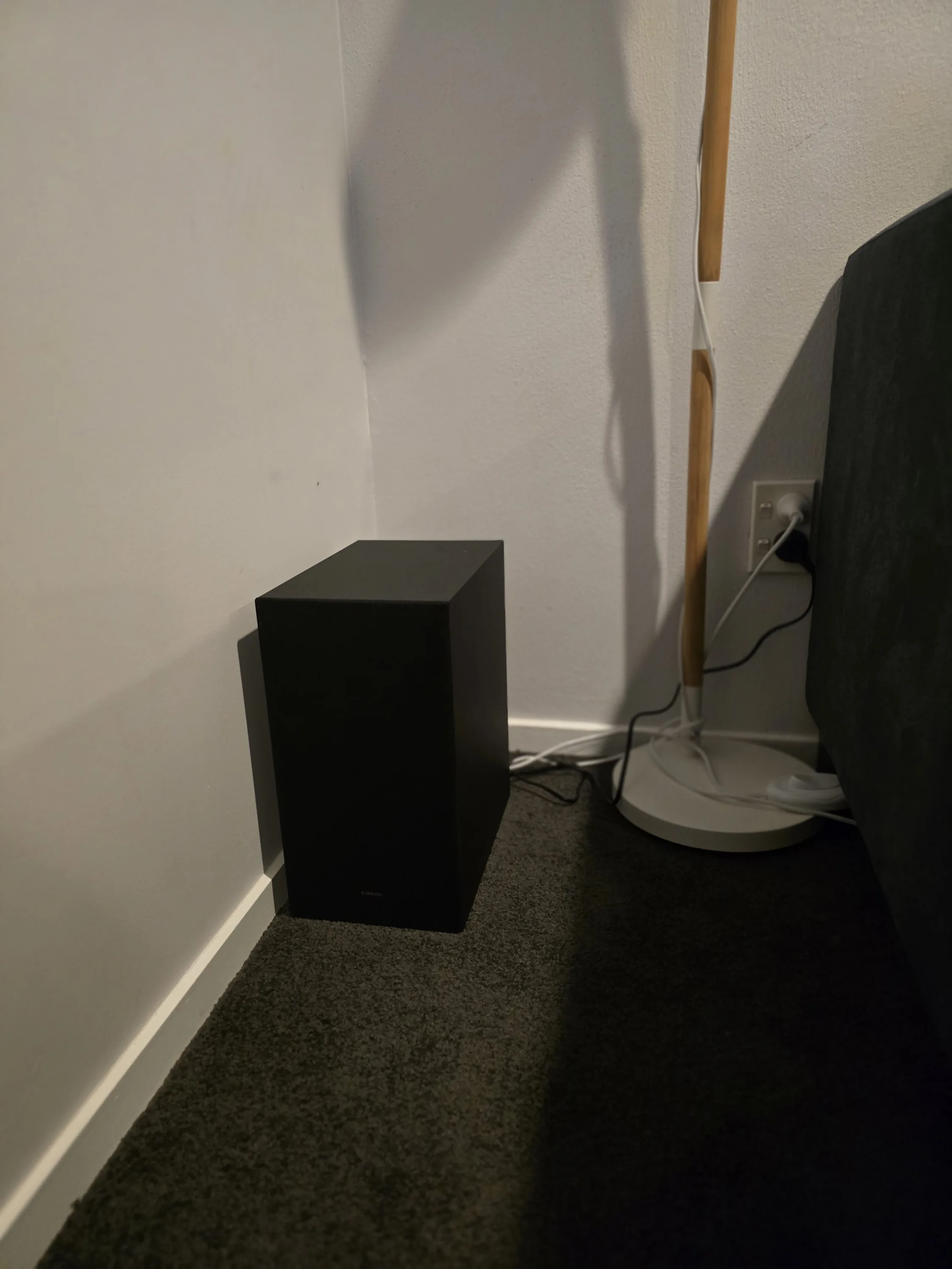 Samsung B750F 5.1 soundbar subwoofer in the corner of the room.
