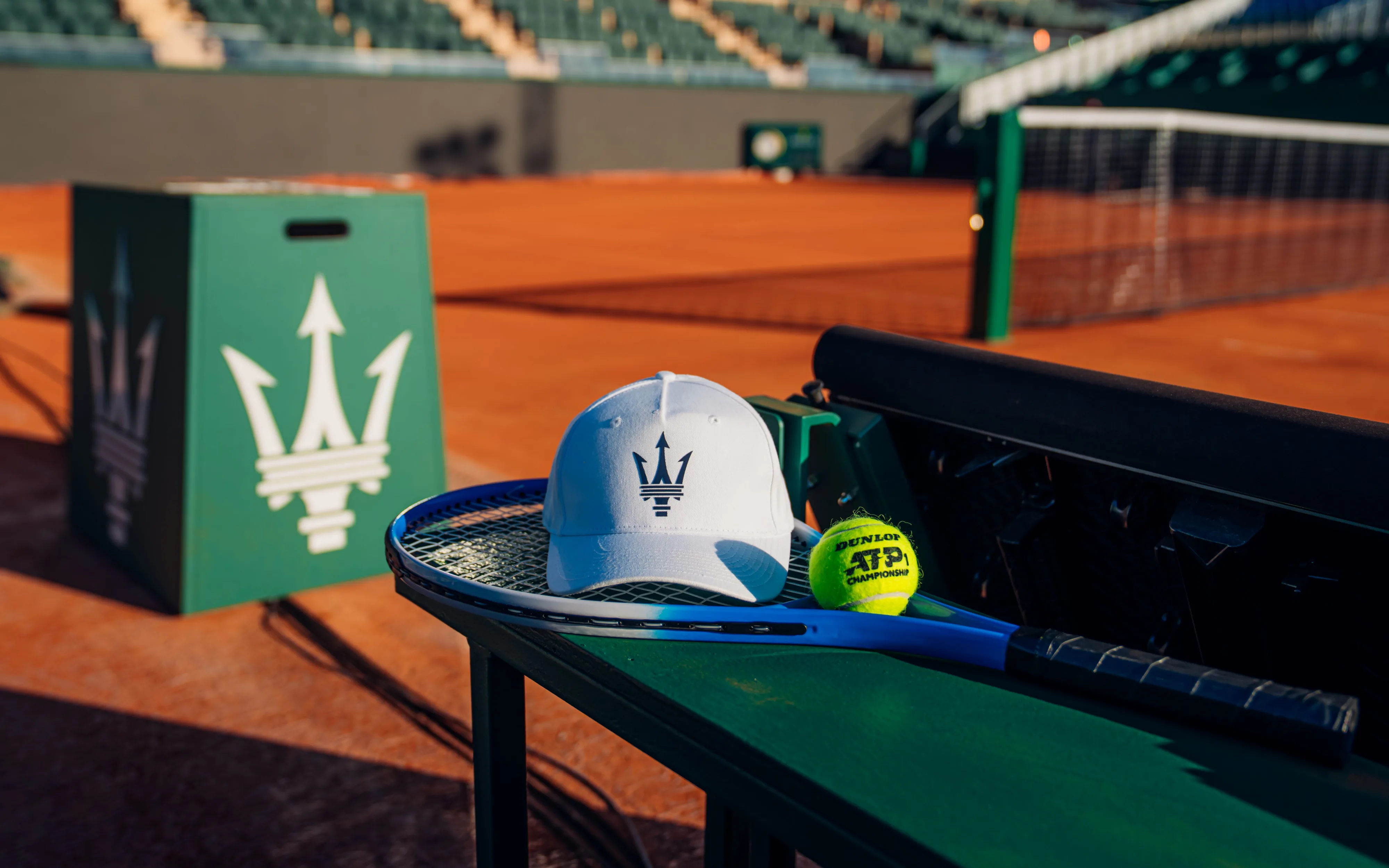 A photo of Maserati branded tennis equipment on the clay courts at the 2026 Rolex Monte-Carlo Masters.
