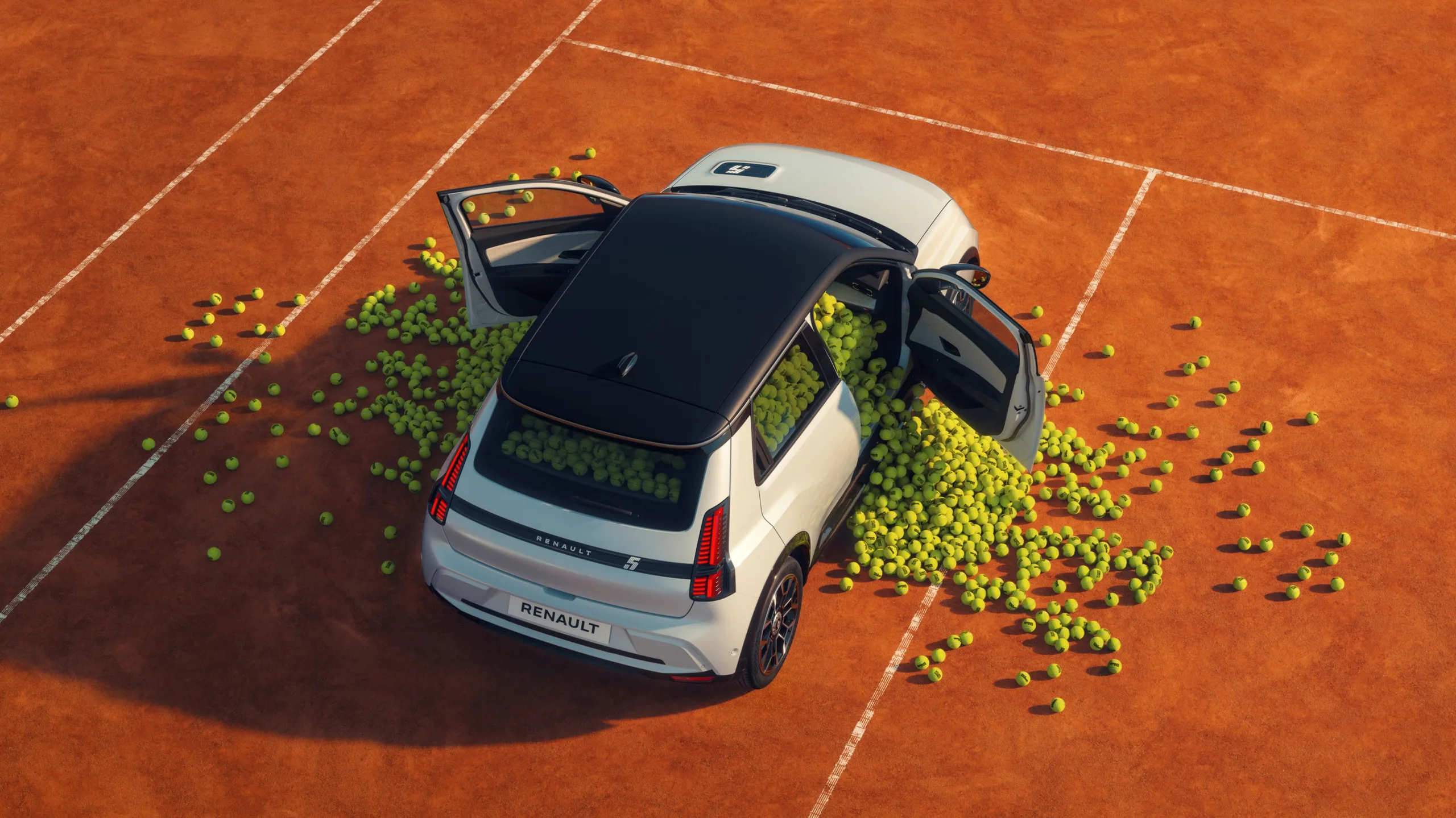 A photo of an Alpine A290 filled with tennis balls on a clay court ahead of the 2026 Roland Garros tournament.