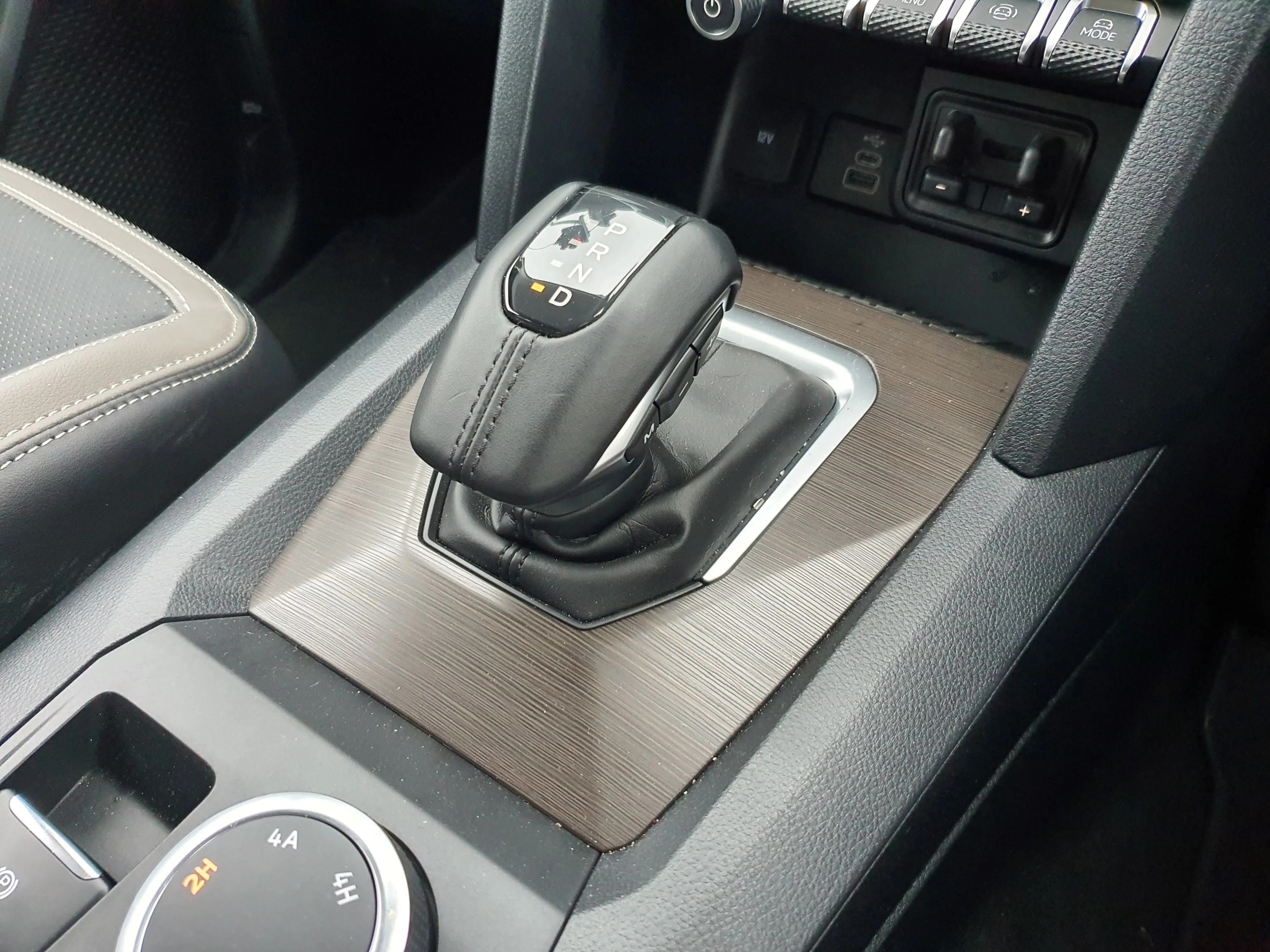 Close up of the gear shifter panel on the inside of a 2026 Volkswagen Amarok V6 Style.